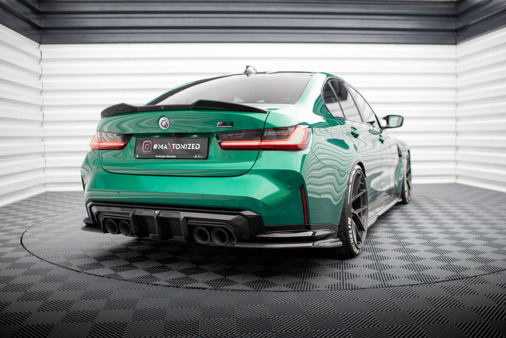 BMW Studio shot of M3 in green with aftermarket rear diffuser